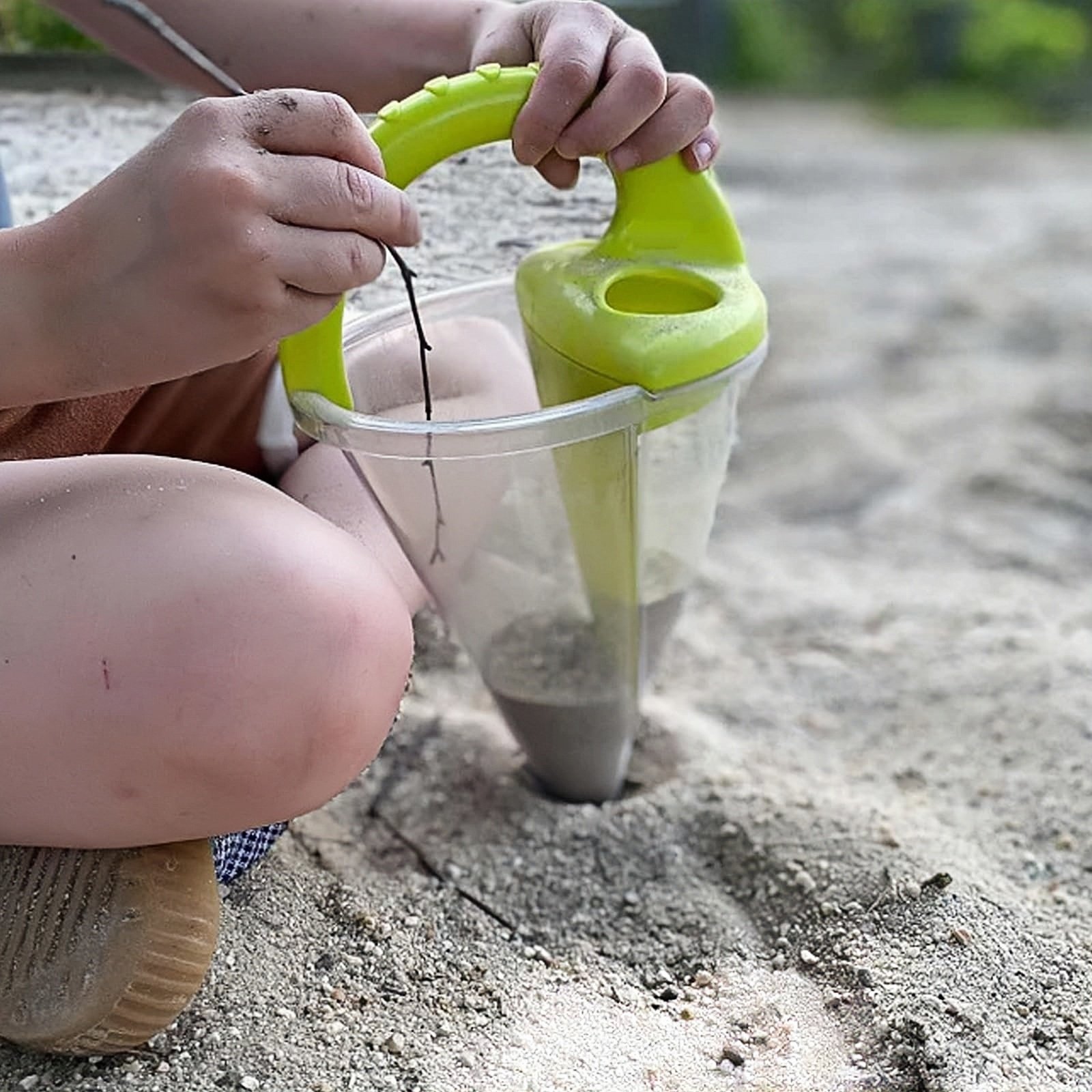Kids on the Beach with Funnel Toy
