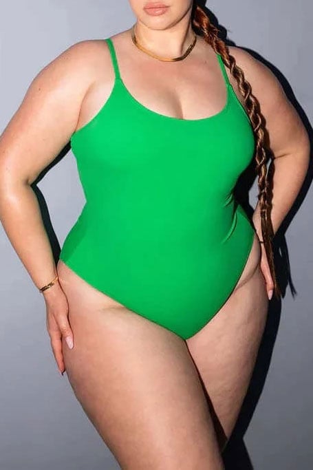 Curvaceously Large breasted woman wearing peacock green bikini